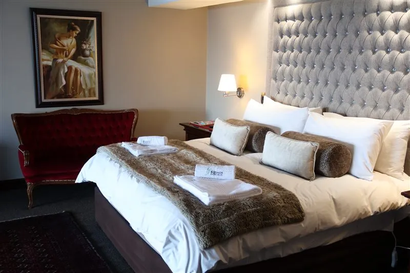 Room 6 at Kosmos Lodge: King Size Bed + Sleeper Couch - Full Dam View