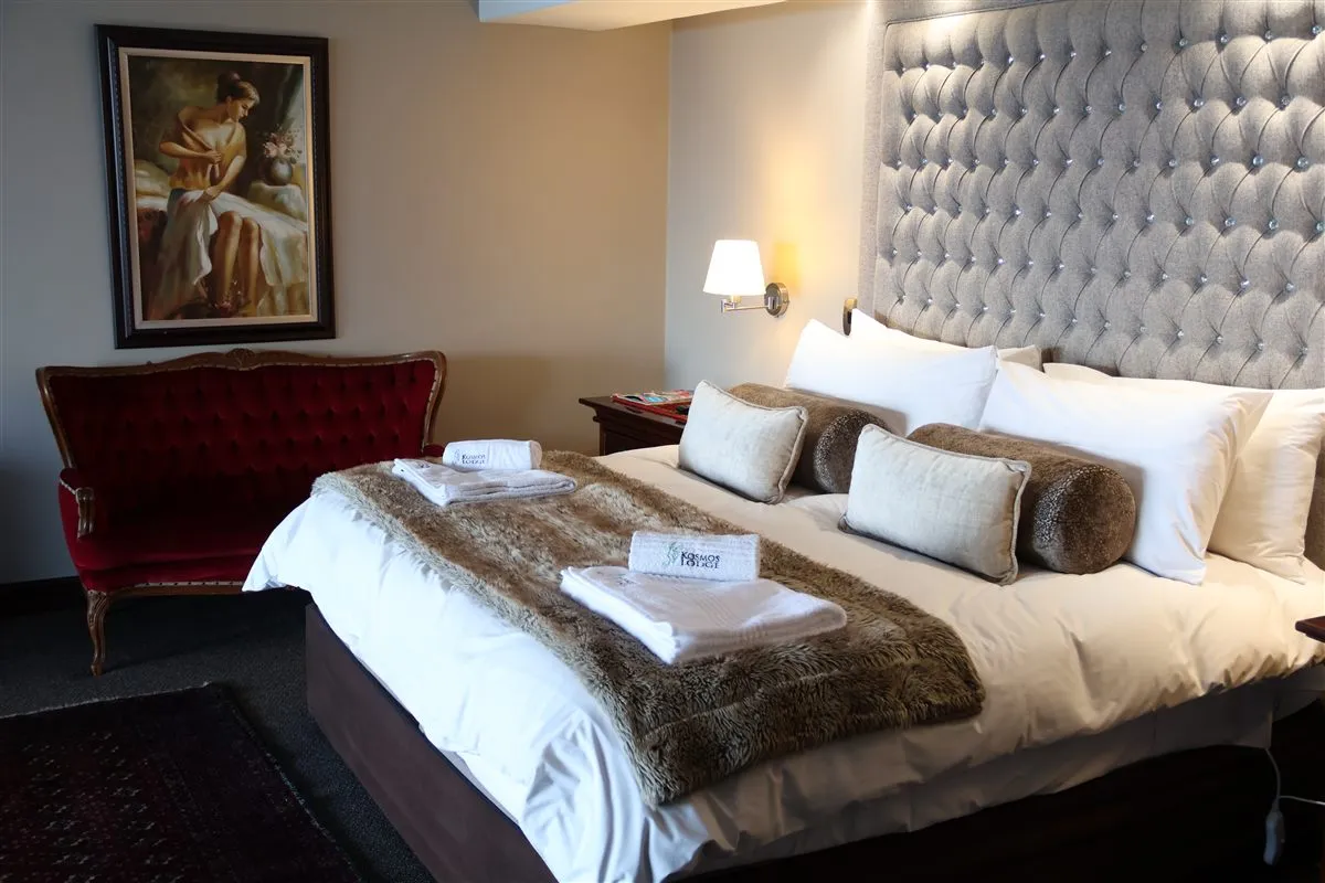 Room 6 at Kosmos Lodge: King Size Bed + Sleeper Couch - Full Dam View